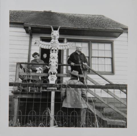 Anna Katzeek, Lilly Nigh (?), Jim Young with a Thunderbird Pole