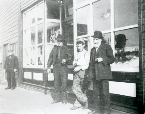 Men posing in front of Kane's Store