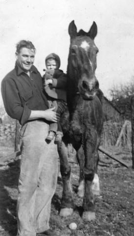 Clarence Peterson and Kermit Brandt with a Horse